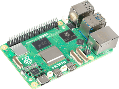 A Raspberry Pi 5 board lying on the desk beside the screen